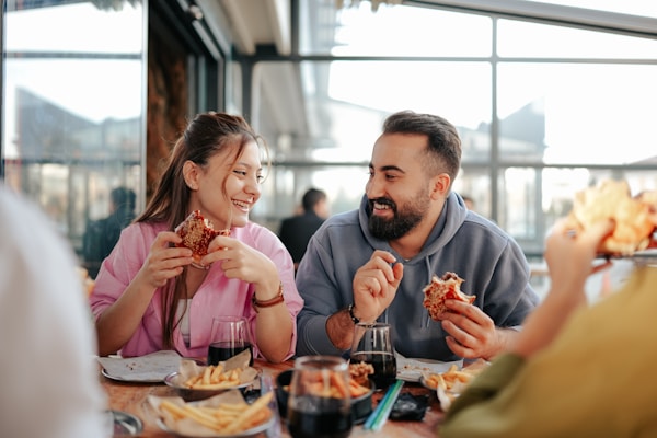 Man and woman eating at table